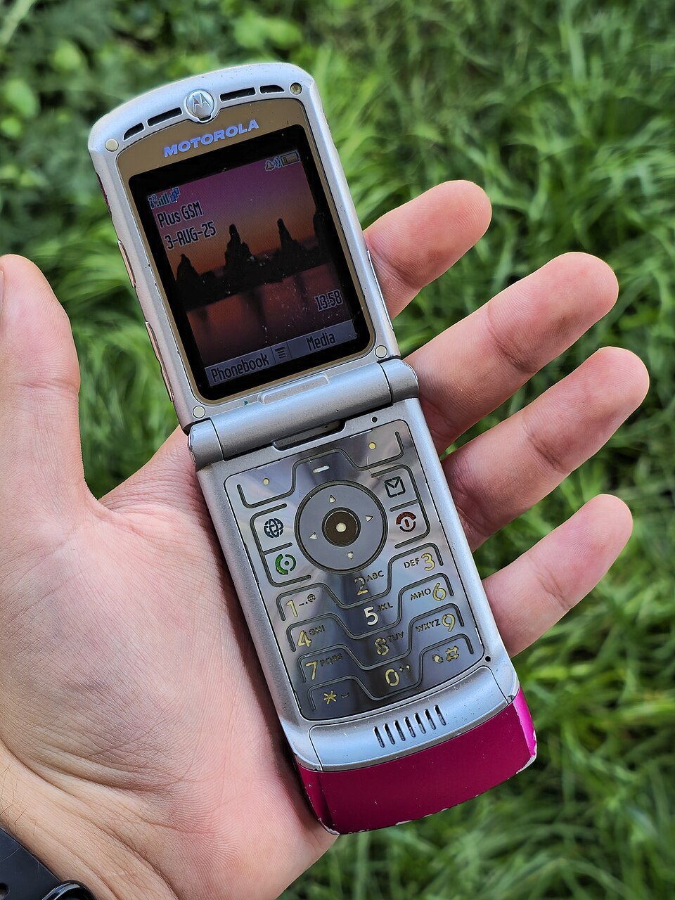 A pink Motorola Razr flip phone